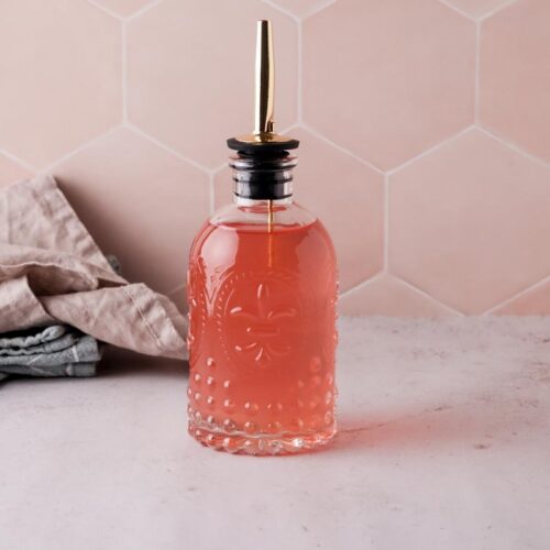 peach simple syrup on a table