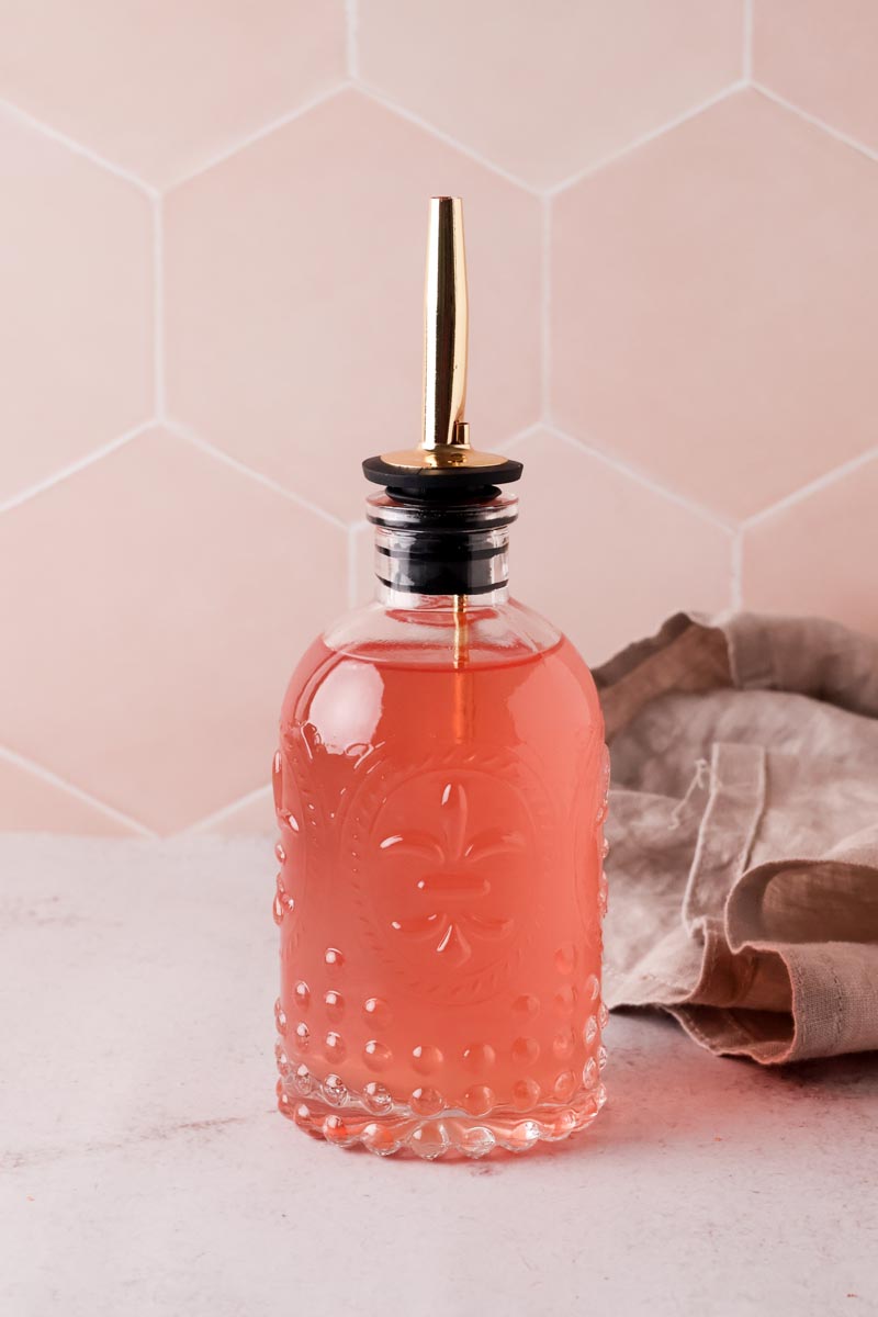 peach simple syrup in a bottle