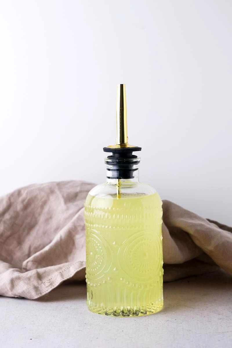 lemon simple syrup in a bottle