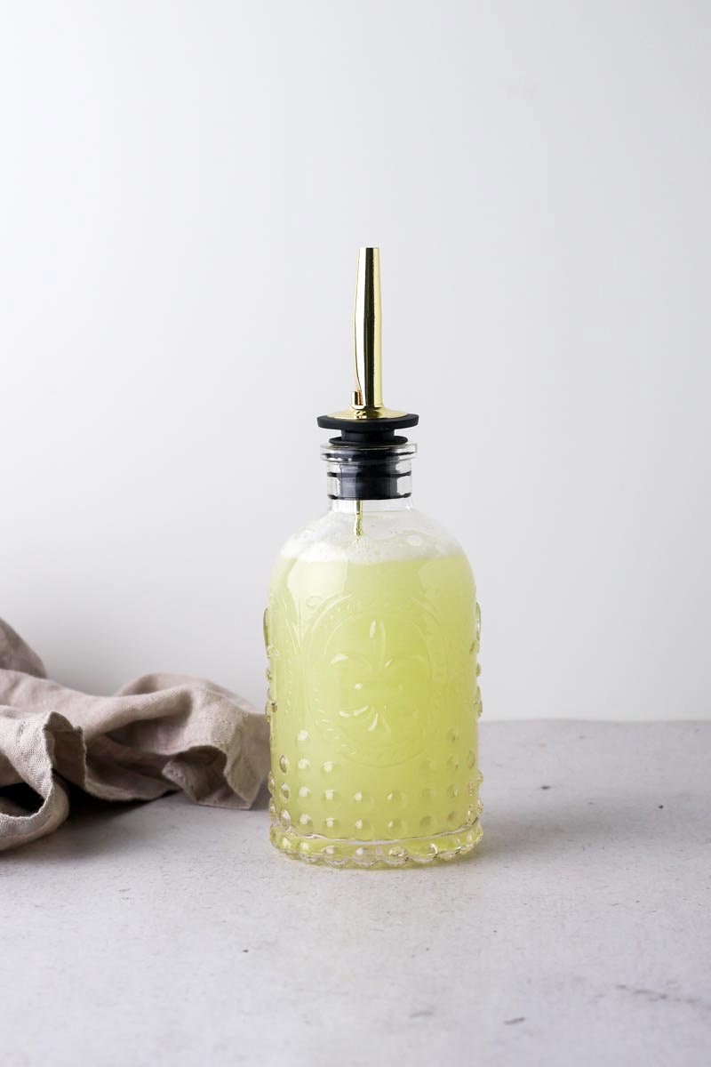 honeydew melon simple syrup in syrup bottle