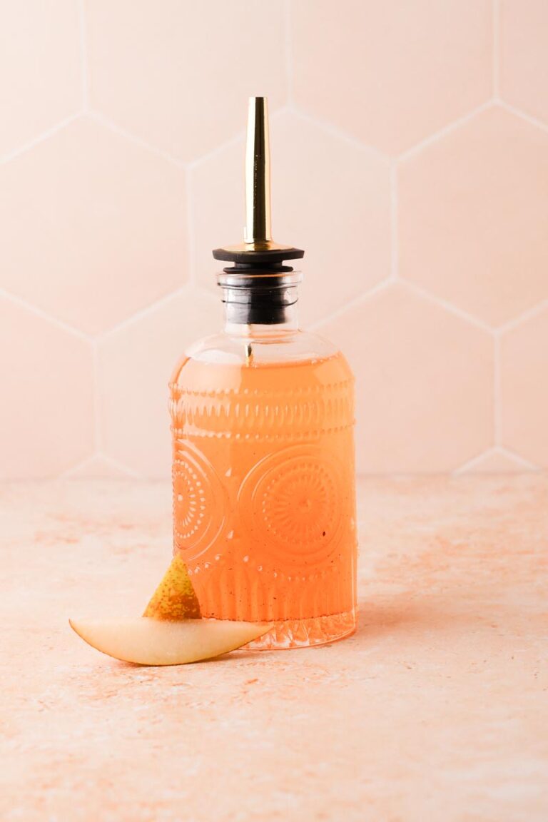 pear simple syrup with some pear wedges on the side