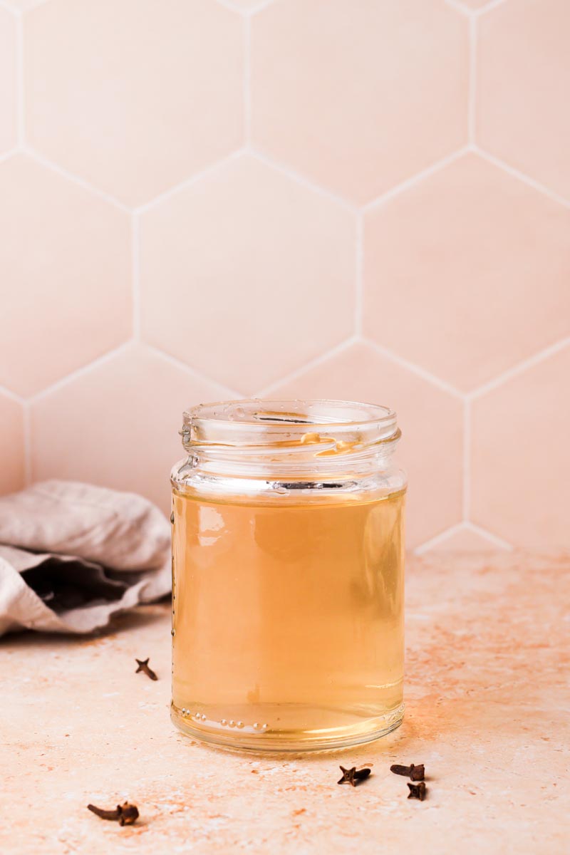 close up of clove simple syrup on a table