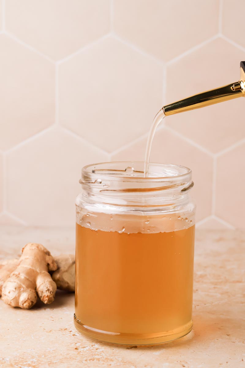a pour shot of ginger simple syrup