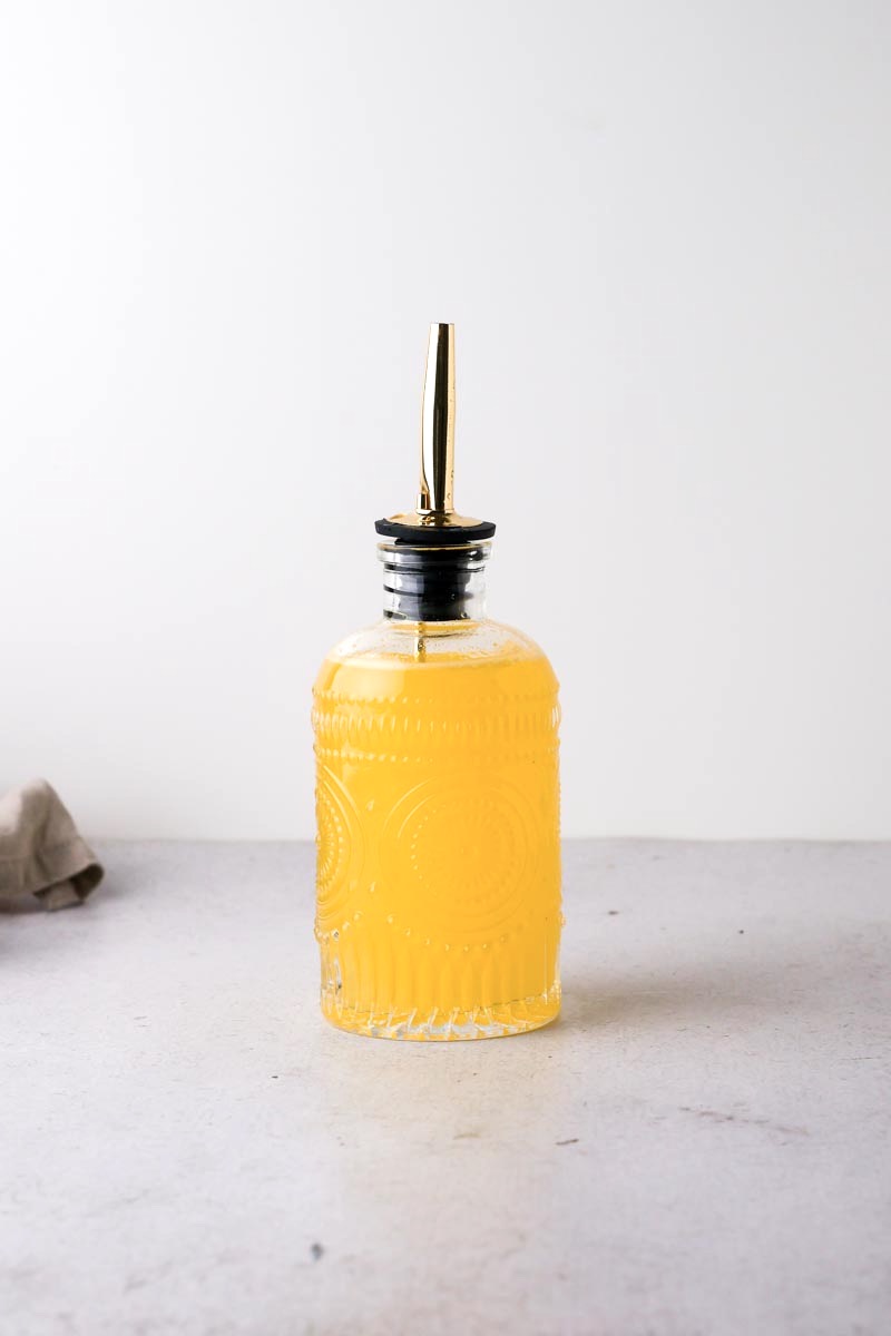 orange simple syrup on the table