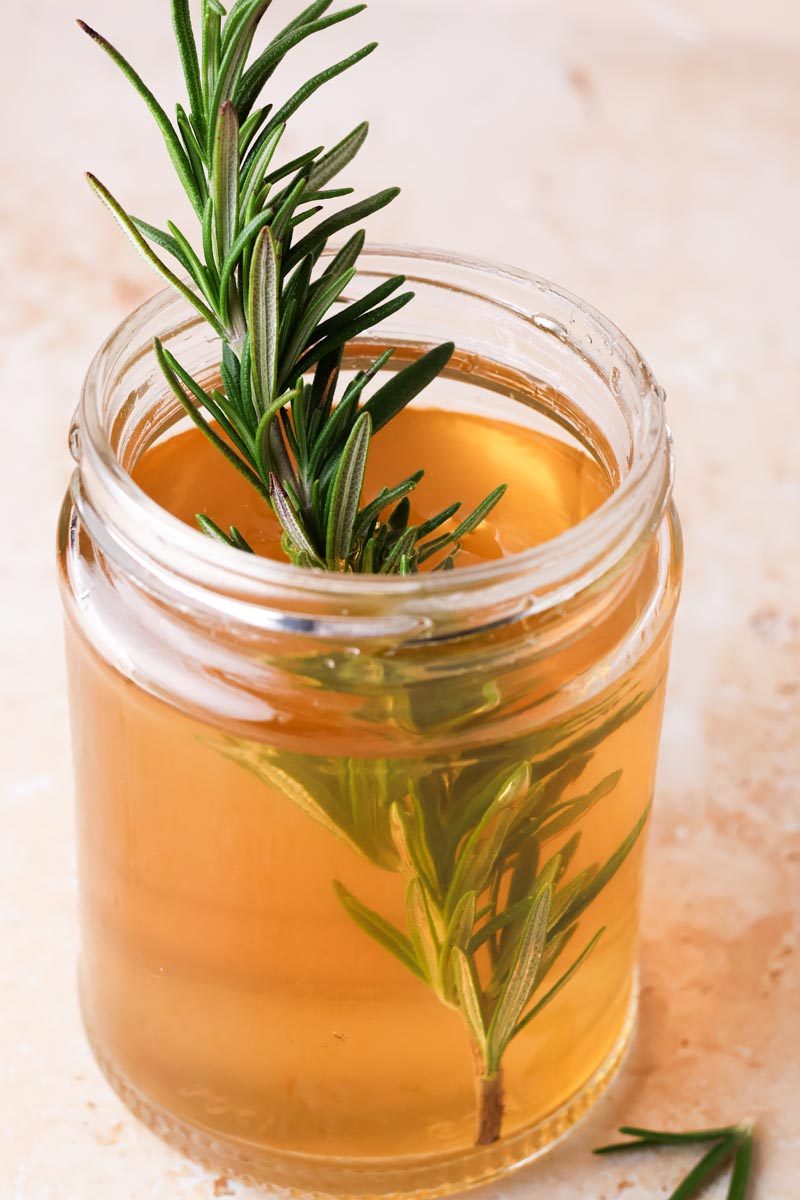 rosemary simple syrup in a jar