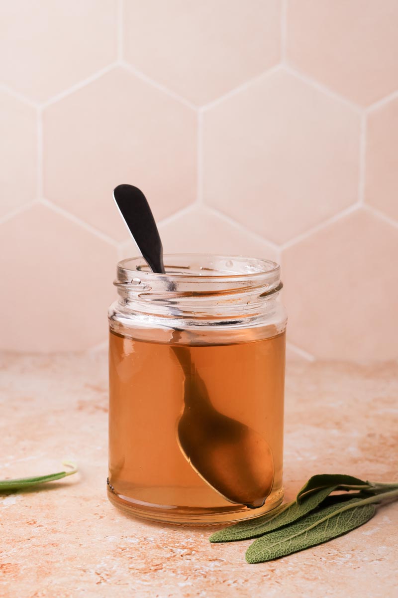 sage simple syrup in a jar