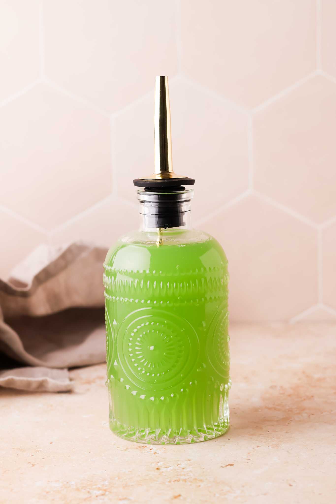 cucumber simple syrup in a bottle