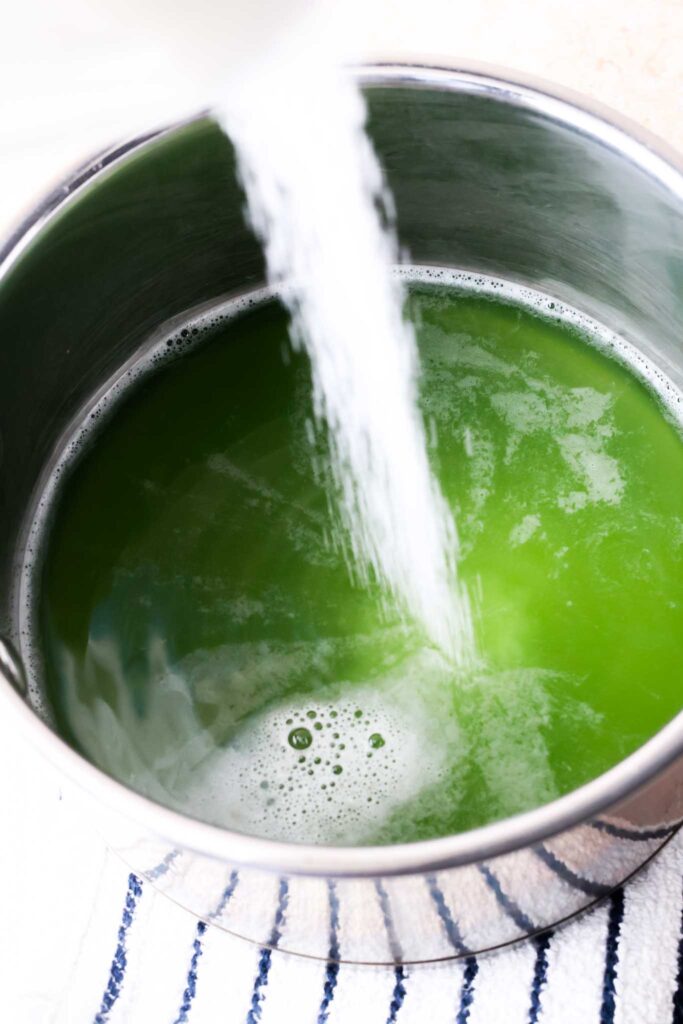 sugar being added to cucumber juice