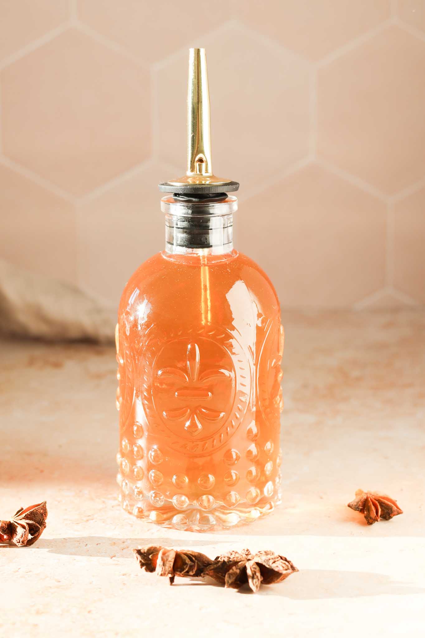 star anise simple syrup in a glass bottle