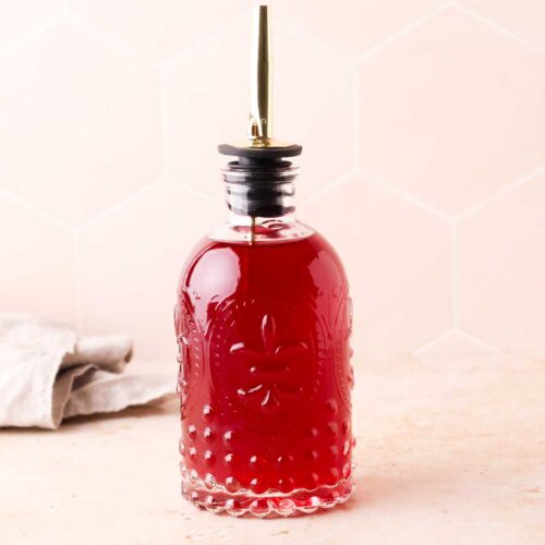 a glass of blackberry simple syrup