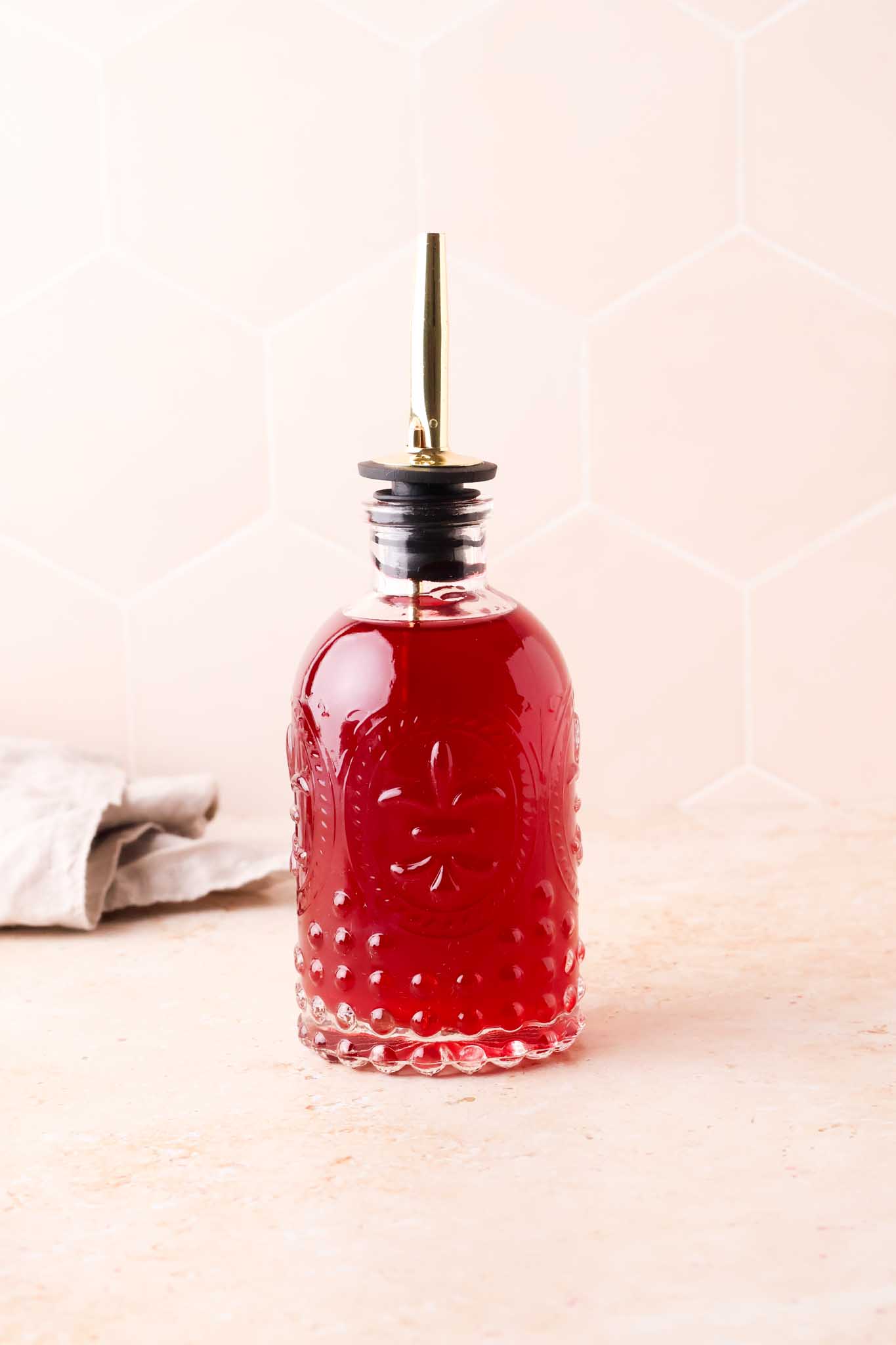 a glass of blackberry simple syrup