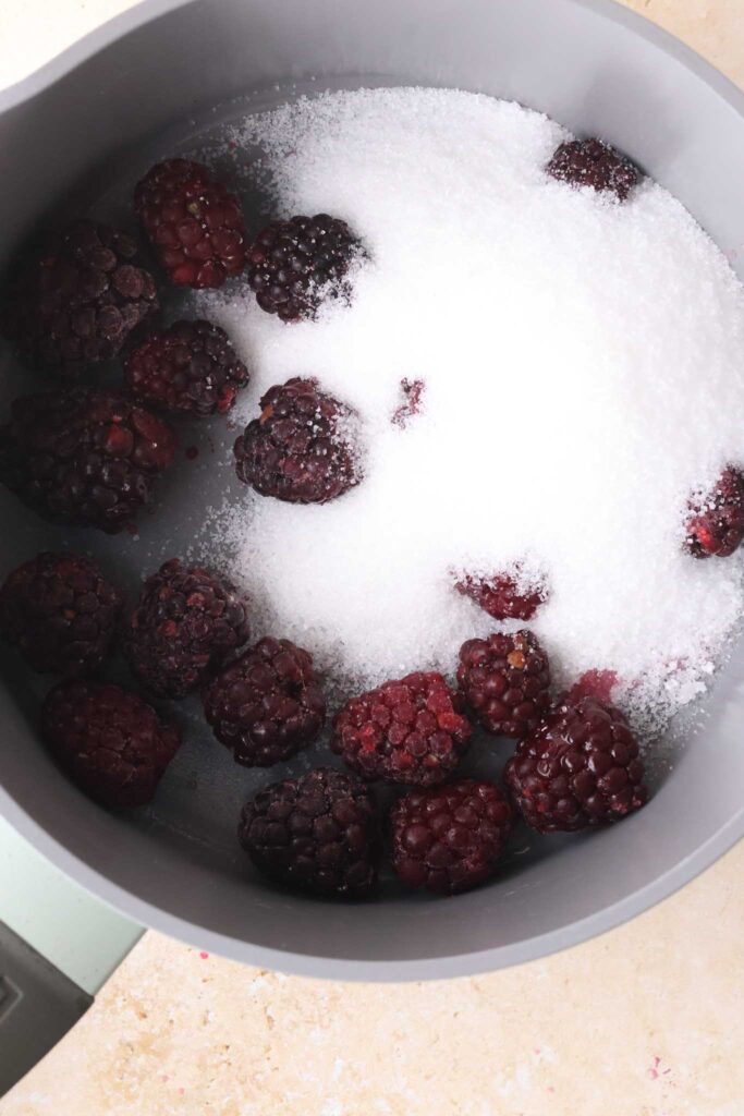 blackberries and sugar in a saucepan