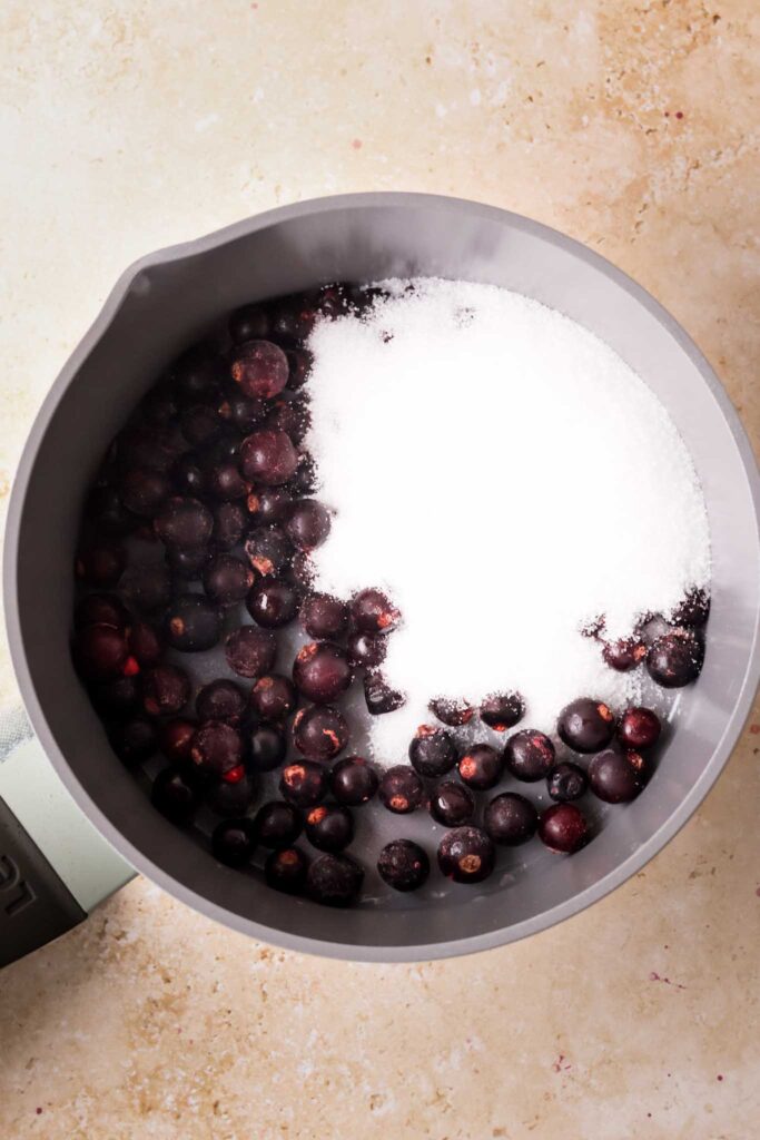 blackcurrant and sugar in a saucepan