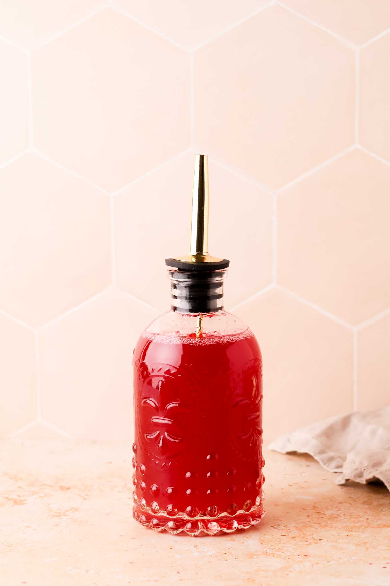 bottle of homemade raspberry syrup
