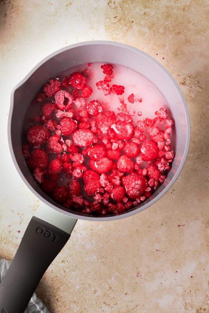 raspberries, sugar and water in small pan