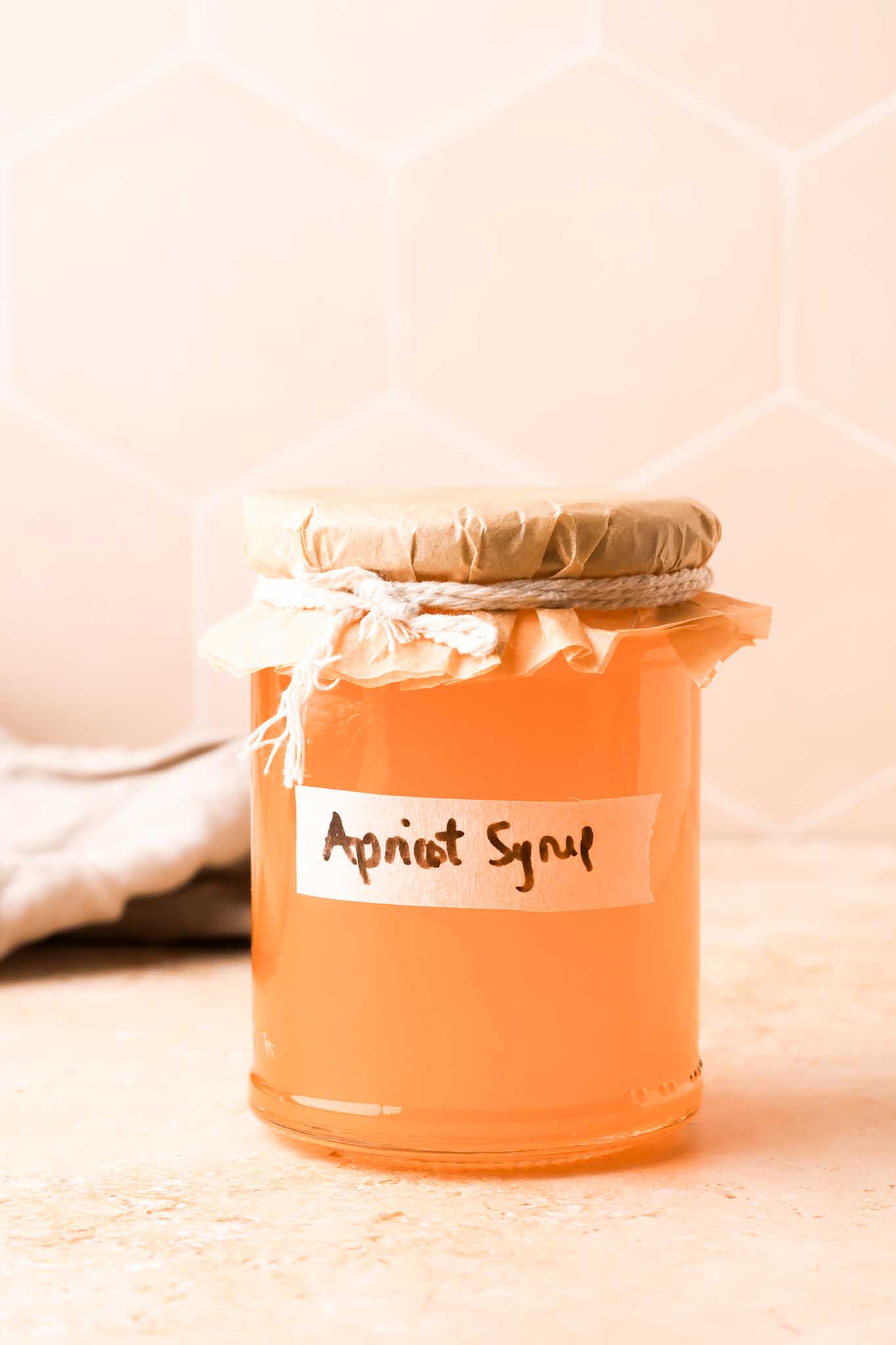 bottle of homemade apricot simple syrup