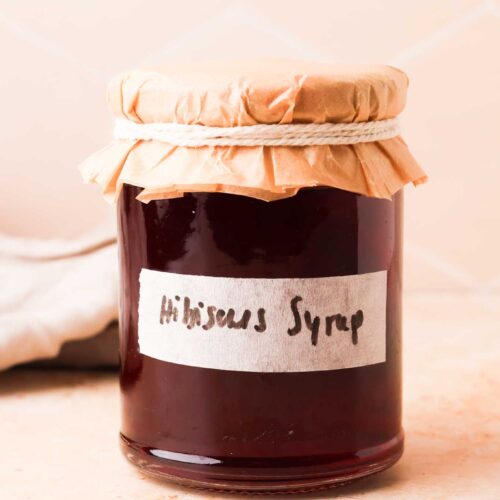 hibiscus simple syrup in a jar