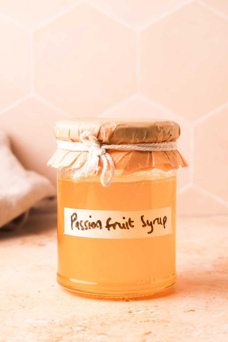 passion fruit simple syrup in a glass bottle