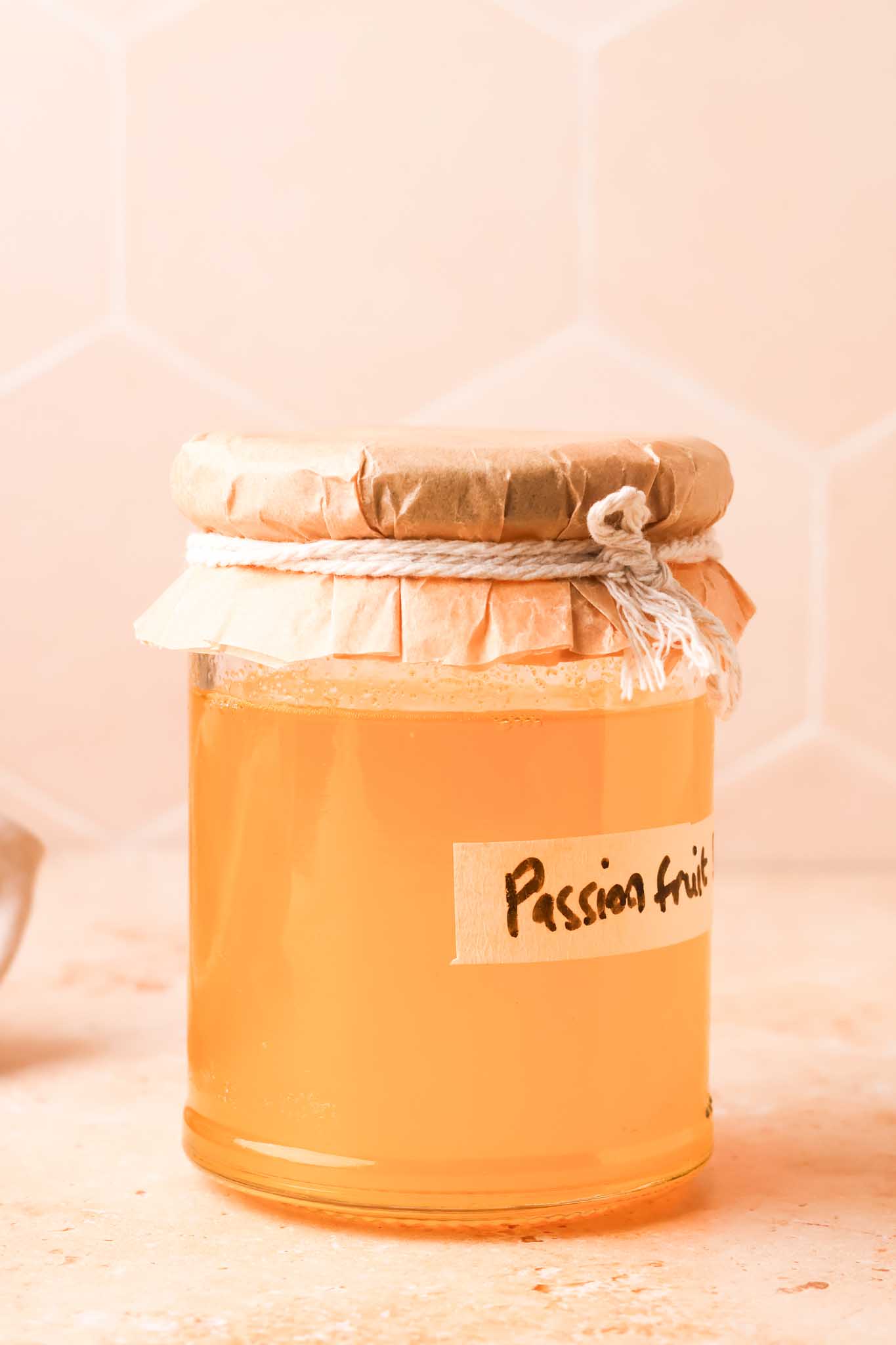 passion fruit simple syrup in a jar
