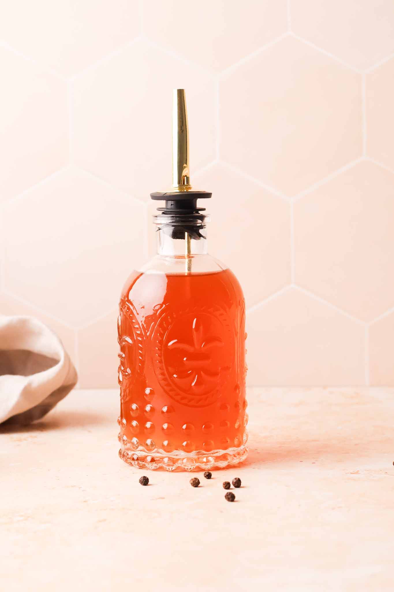 black pepper simple syrup in a jar