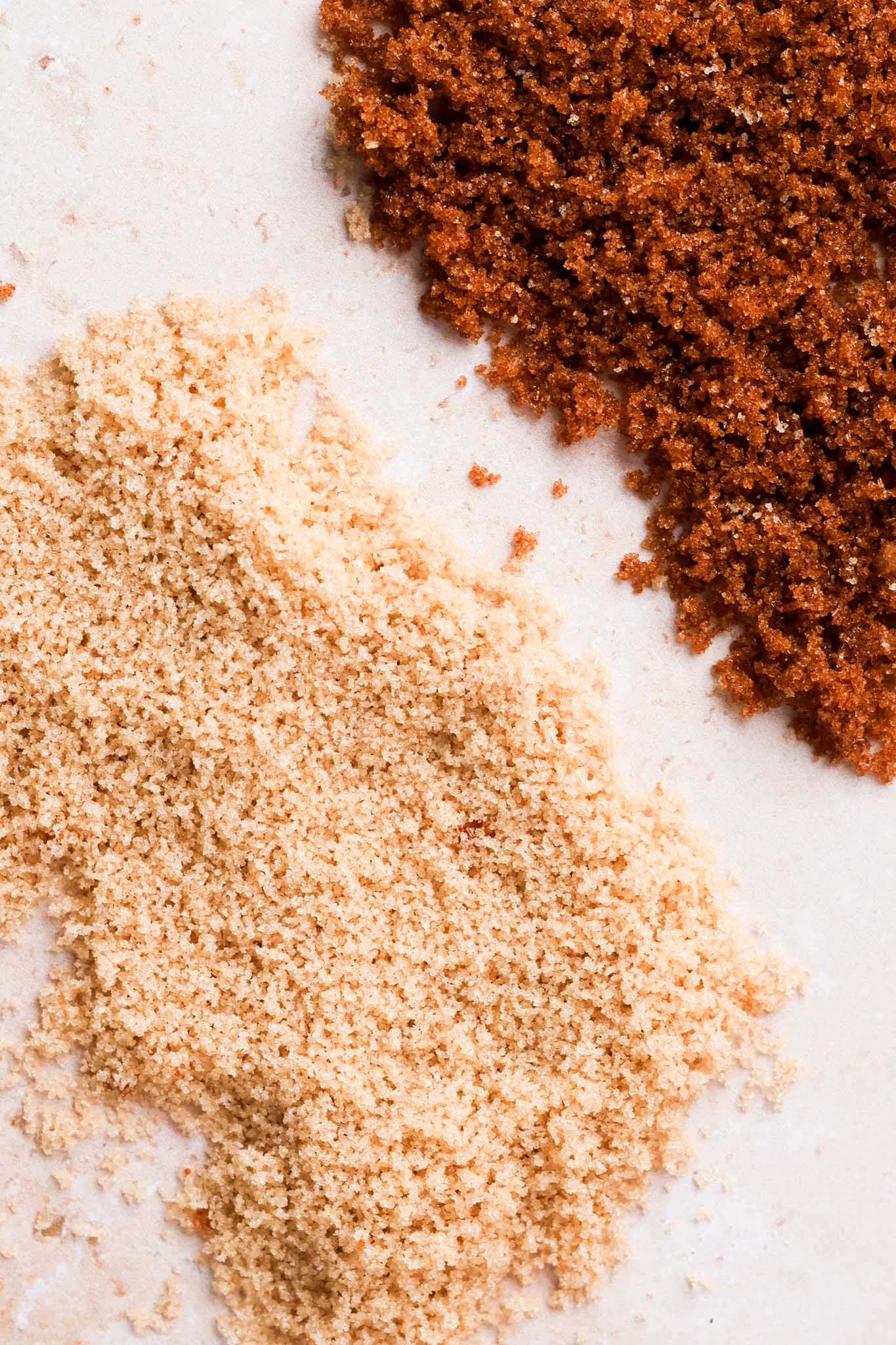 side by side photo of light brown and dark brown sugars