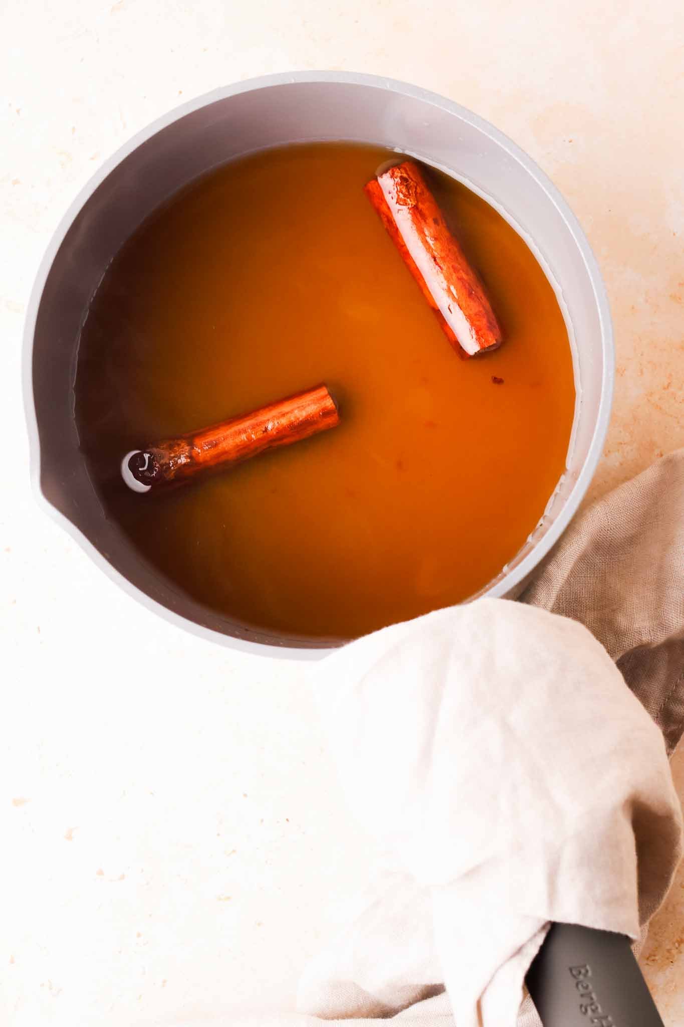 freshly made cinnamon simple syrup in saucepan