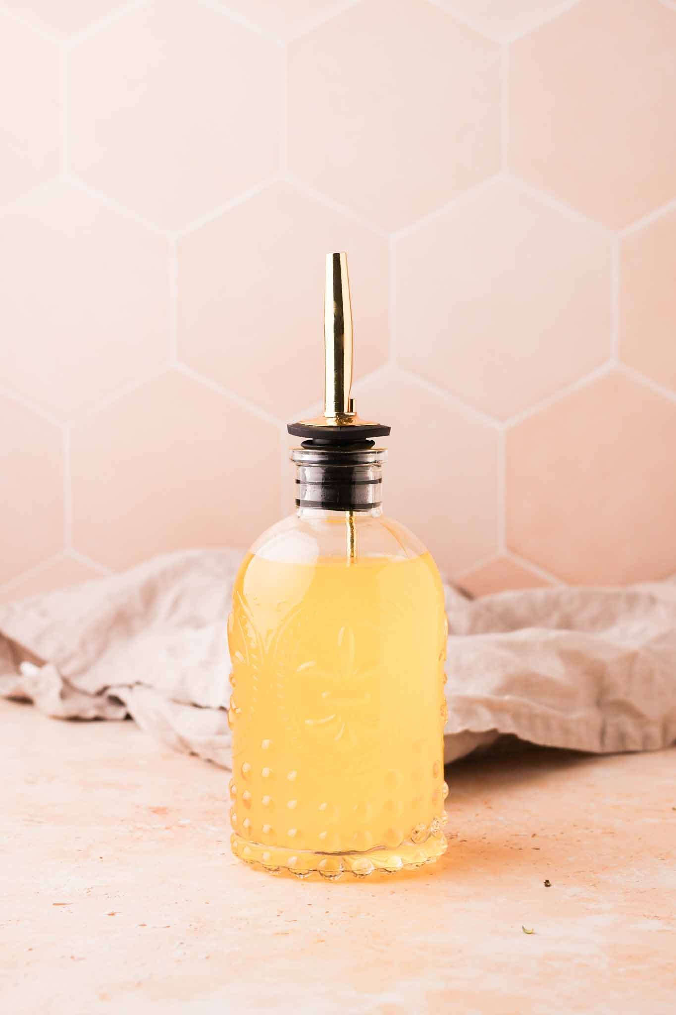 homemade orange blossom simple syrup in a glass bottle